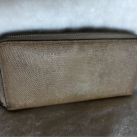Tan with a gold sheen, COACH wallet. Beautiful addition to your fall outfits! 🍂 - Picture 2 of 3